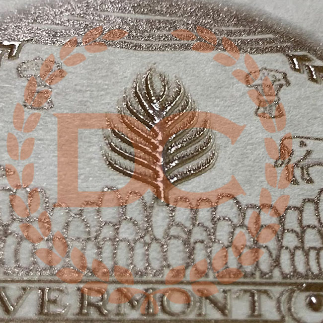 A common request, gold embossing onto a flat document. This is very popular finish! Look at the tree in the middle, and notice the depth of it. Again real good solid embossing, not low end embossing! fully embossed shiny gold metallic seal on fake vermont diploma