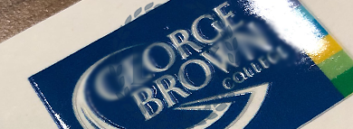 upclose image of a George Brown College logo in full color on a custom made diploma