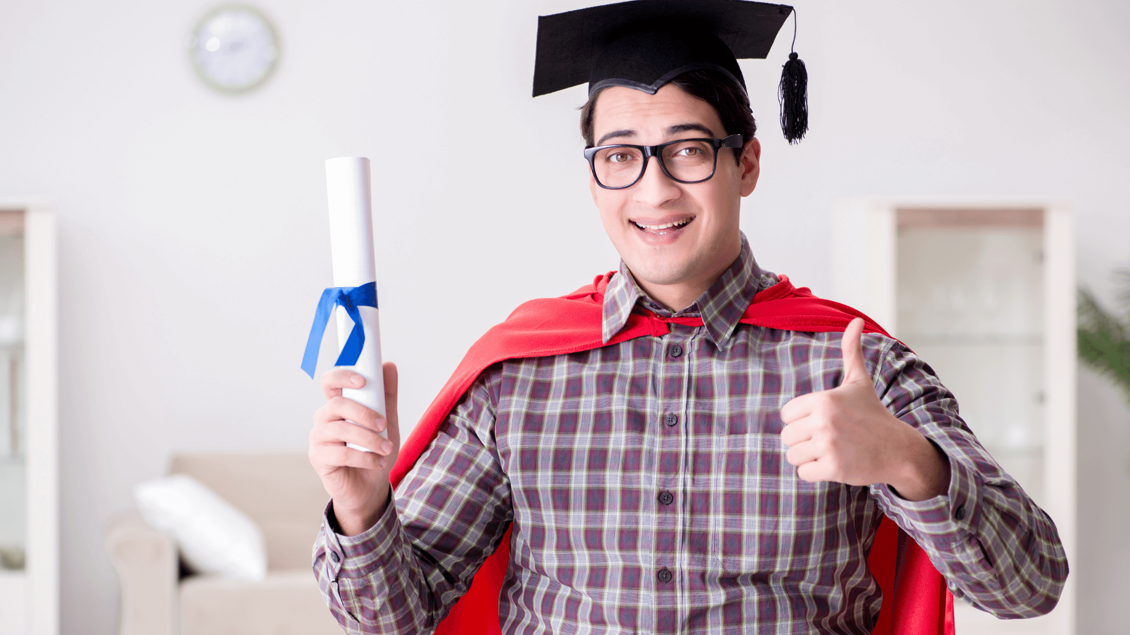 graduate and cap and gown feeling like superhero man's confidence is built up with a diploma and he feels like a superhero