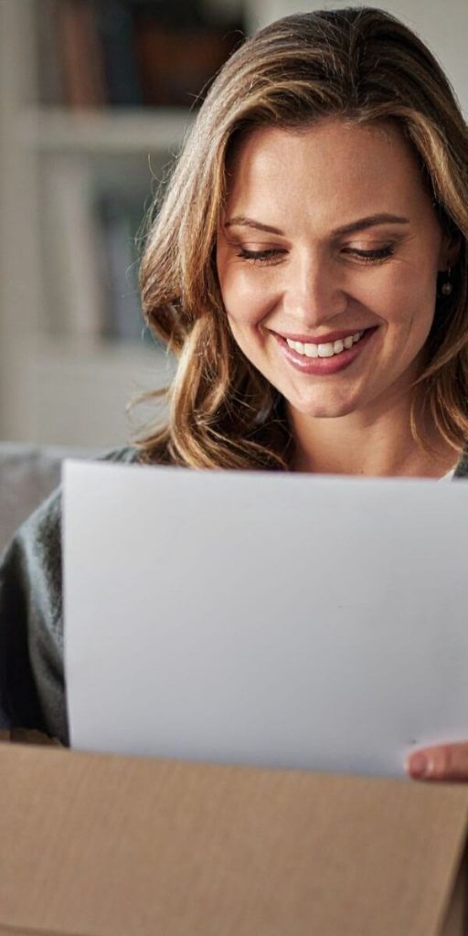 Woman receiving her fake GED diploma replacement from Diploma Company
