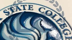 Close-up of raised embossed seal on replica Daytona State College diploma in blue and silver